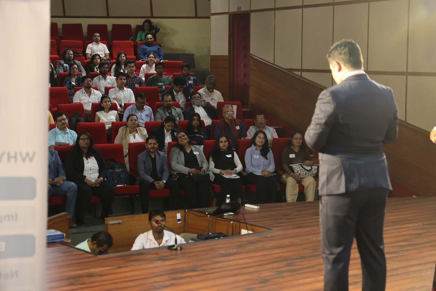 Gaurav speaking to a full auditorium at a Jobseeker Circle event